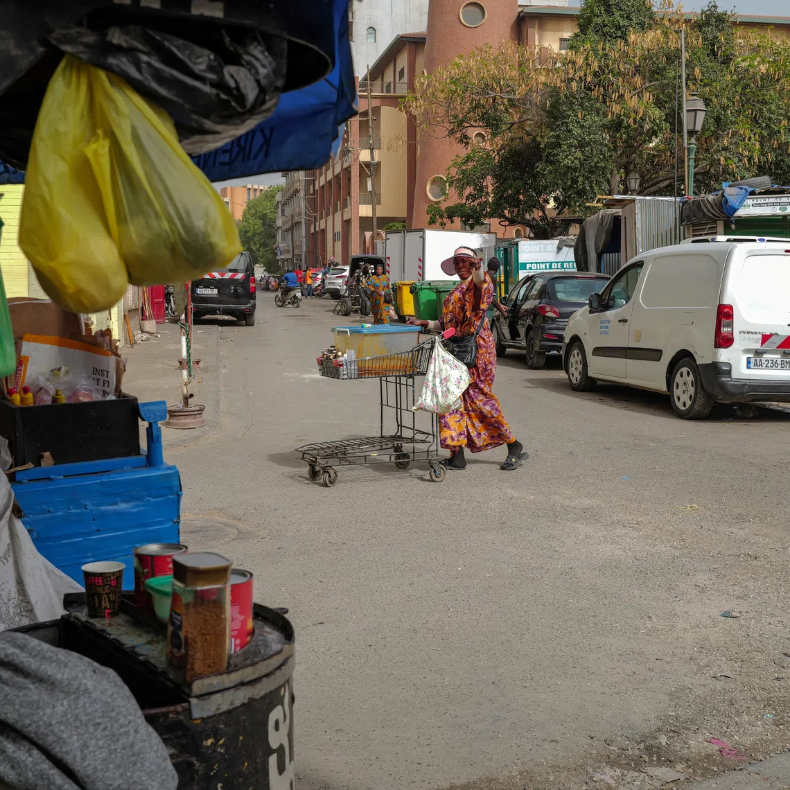 A street food vendor pushes her cart near Kermel Market in downtown Dakar, Senegal, May 21, 2025. REUTERS/Zohra Bensemra