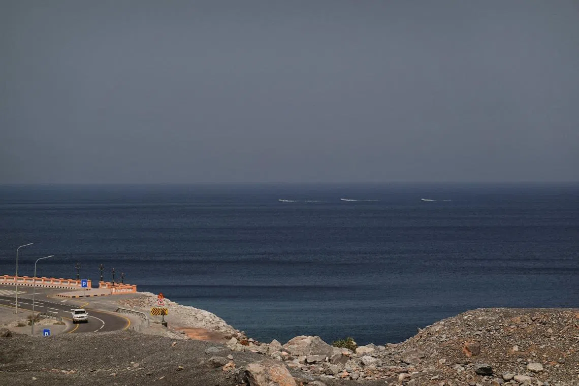 A car rides along the coast of Musandam overlooking the Strait of Hormuz amid the U.S.-Israeli conflict with Iran, Oman, March 2, 2026.