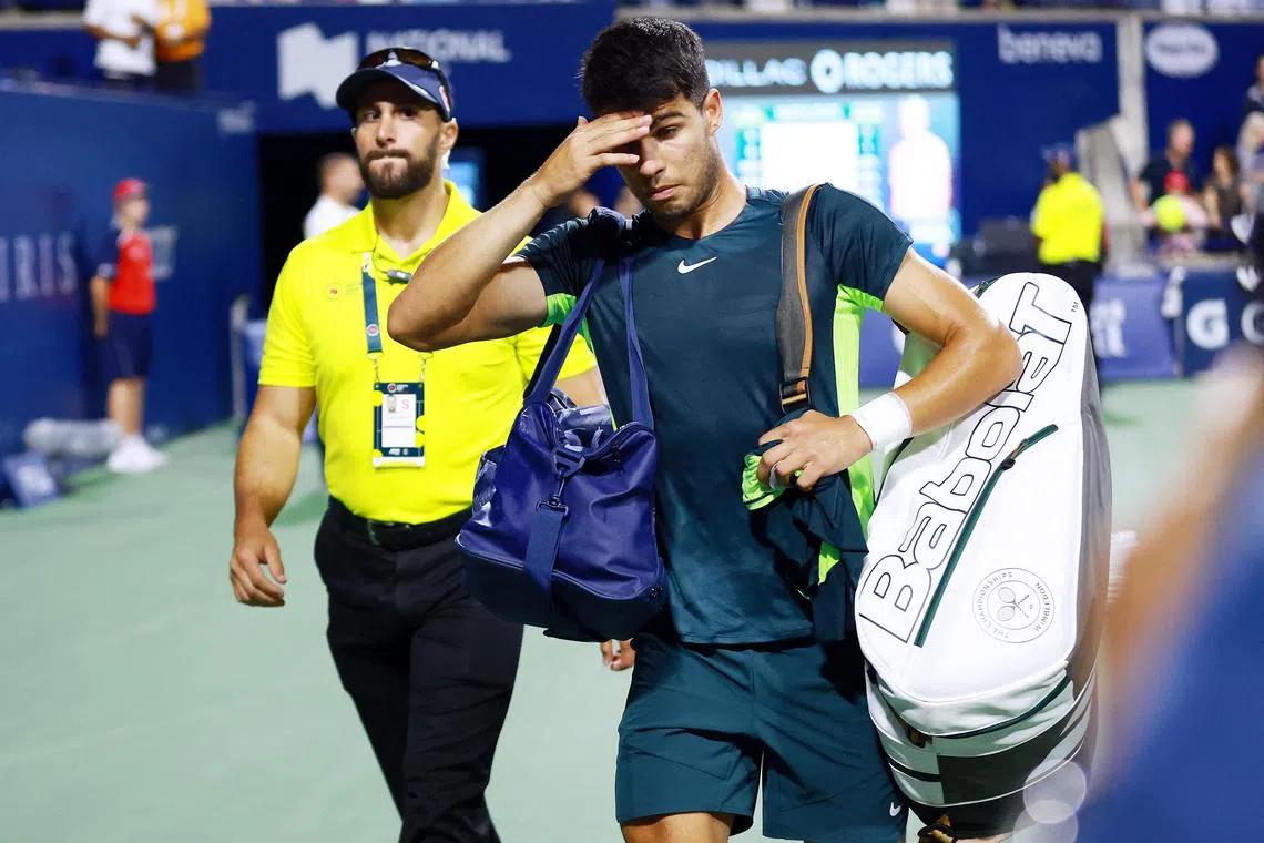Carlos Alcaraz leaves the court after losing to Tommy Paul in the quarter-finals of the Toronto Masters.