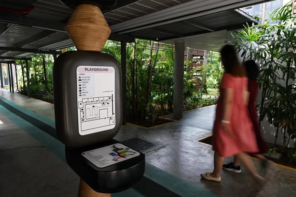 A wayfinding totem (left) and a footpath (right) for the visually handicapped at the Enabling Village on Sept 15.