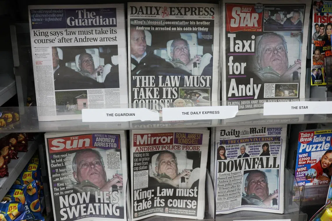 British newspapers, featuring coverage of the arrest of Andrew Mountbatten-Windsor, younger brother of Britain's King Charles, on suspicion of misconduct in public office, sit on display in a newsagent in London, Britain, February 20, 2026. REUTERS/Jack Taylor