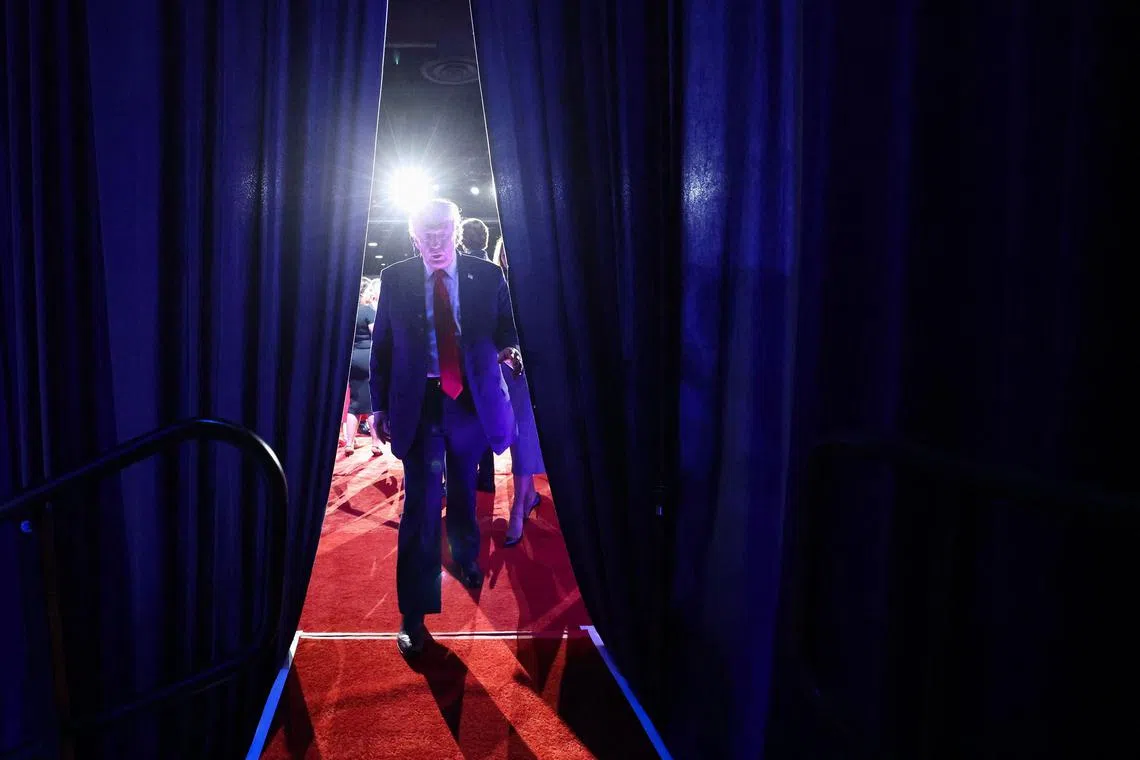WEST PALM BEACH, FLORIDA - NOVEMBER 06: Republican presidential nominee, former U.S. President Donald Trump departs an election night event at the Palm Beach Convention Center on November 06, 2024 in West Palm Beach, Florida. Americans cast their ballots today in the presidential race between Republican nominee former President Donald Trump and Vice President Kamala Harris, as well as multiple state elections that will determine the balance of power in Congress. Win McNamee/Getty Images/AFP (Photo by WIN MCNAMEE / GETTY IMAGES NORTH AMERICA / Getty Images via AFP)