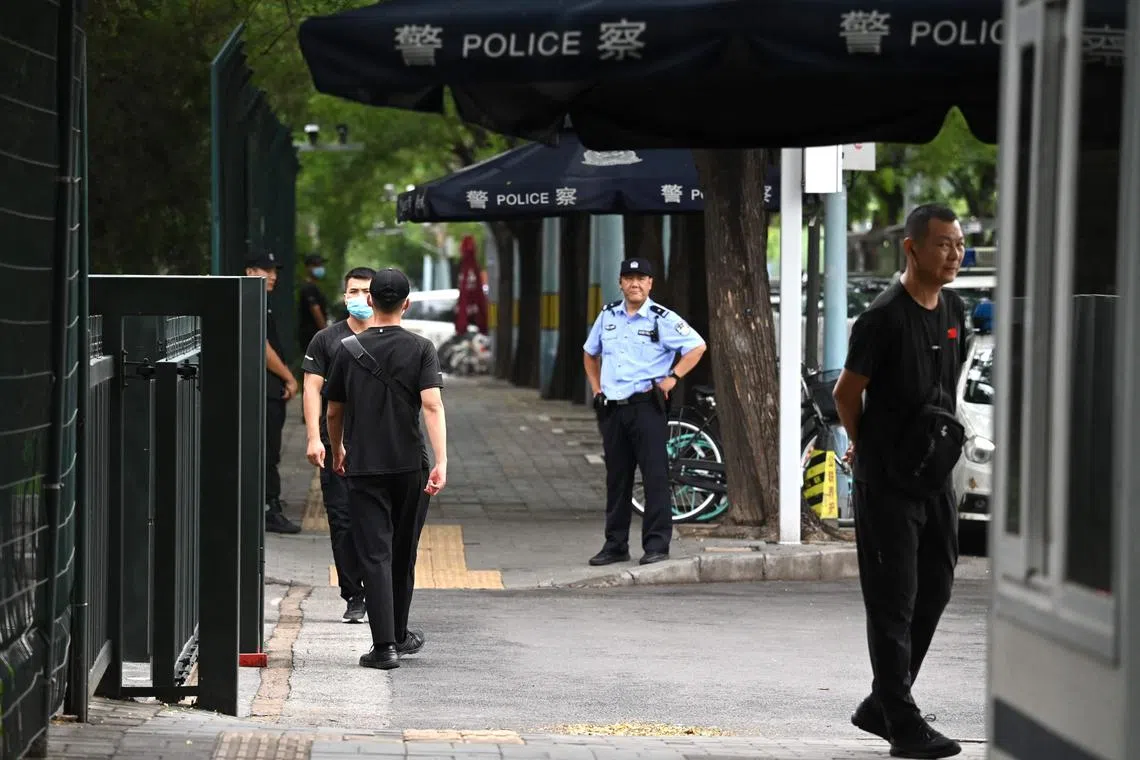 Police and security personnel guard the entrance of the Japanese embassy in Beijing on Aug 26.