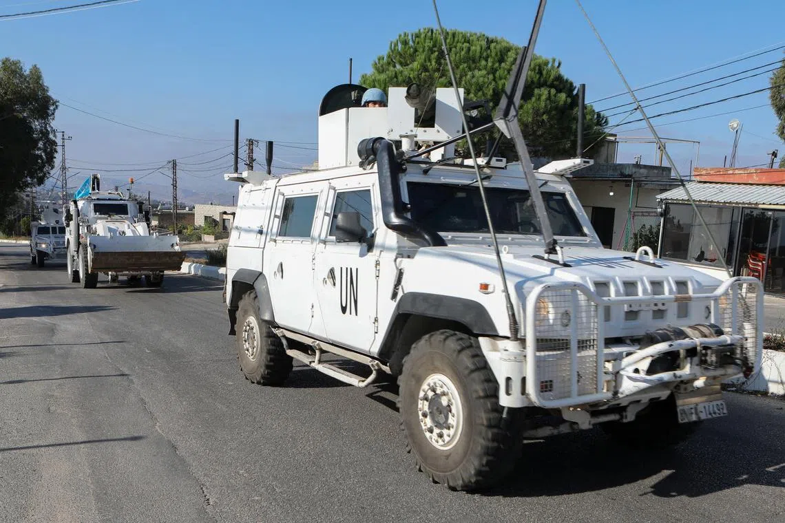 UN peacekeepers (UNIFIL) vehicles drive in Marjayoun, near the border with Israel, amid ongoing hostilities between Hezbollah and Israeli forces, southern Lebanon October 11, 2024. REUTERS/Karamallah Daher/File Photo