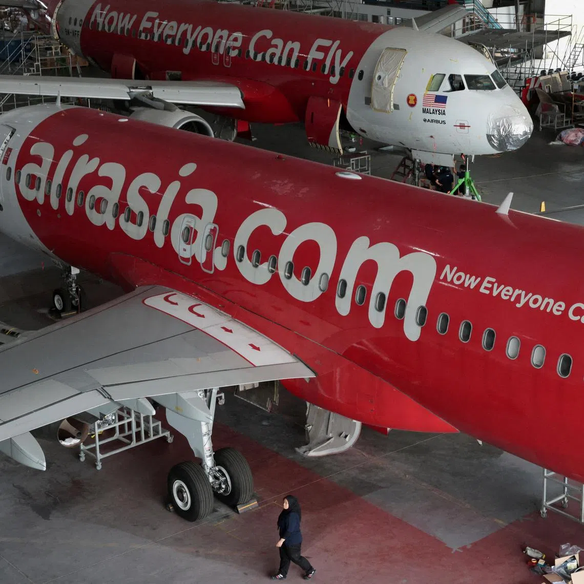 FILE PHOTO: AirAsia aircrafts undergo maintenance in a hangar of Asia Digital Engineering, the aircraft services and maintenance unit of AirAsia-operator Capital A at Subang, Malaysia July 15, 2024. REUTERS/Hasnoor Hussain/File Photo