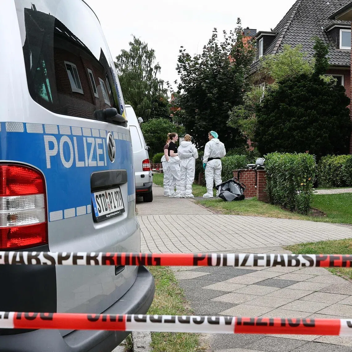 Forensic Police officers work at the scene where six people were killed in a shooting the day before in Stade, northern Germany, a city some 50 kilometres west of Hamburg, on June 30, 2026. The suspected shooter who killed six people at a German youth welfare centre on Monday was in a custody dispute over his three-month-old daughter, police said. The victims of the shooting -- four women and two men -- were youth welfare employees, a police official told a press conference. The girl and her mother were in the office at the time of the shooting but were not harmed. (Photo by Ibrahim OT / AFP)
