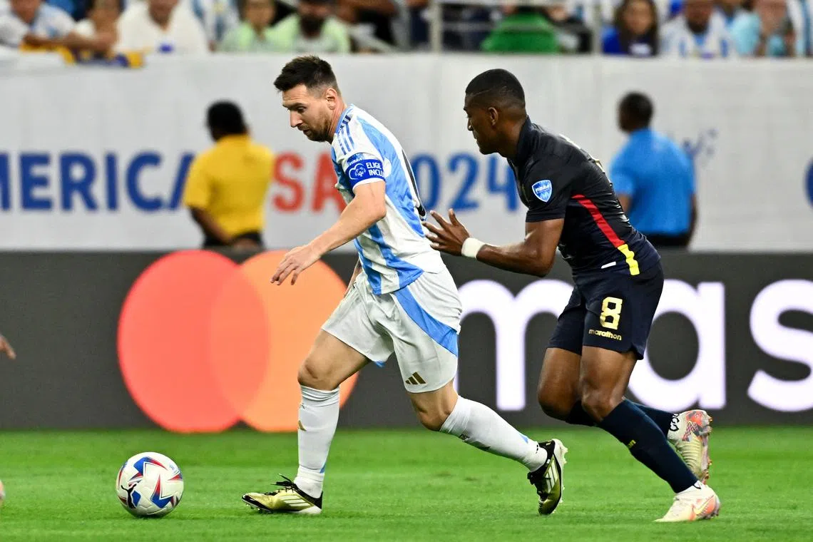 Jul 4, 2024; Houston, TX, USA; Argentina's striker Lionel Messi (10) controls the ball as Ecuador's midfielder Carlos Gruezo (8) defends during the first half at NRG Stadium. Mandatory Credit: Maria Lysaker-USA TODAY Sports/ File Photo
