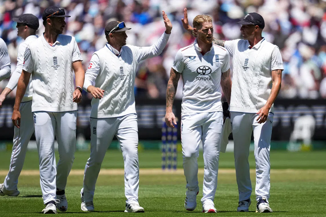 Cricket - The Ashes - Australia v England - Fourth Test -  MCG, Melbourne, Australia - December 27, 2025 England's Josh Tongue, Joe Root, Ben Stokes and Brydon Carse celebrate after taking the final wicket of Australia's 2nd innings REUTERS/Asanka Brendon Ratnayake