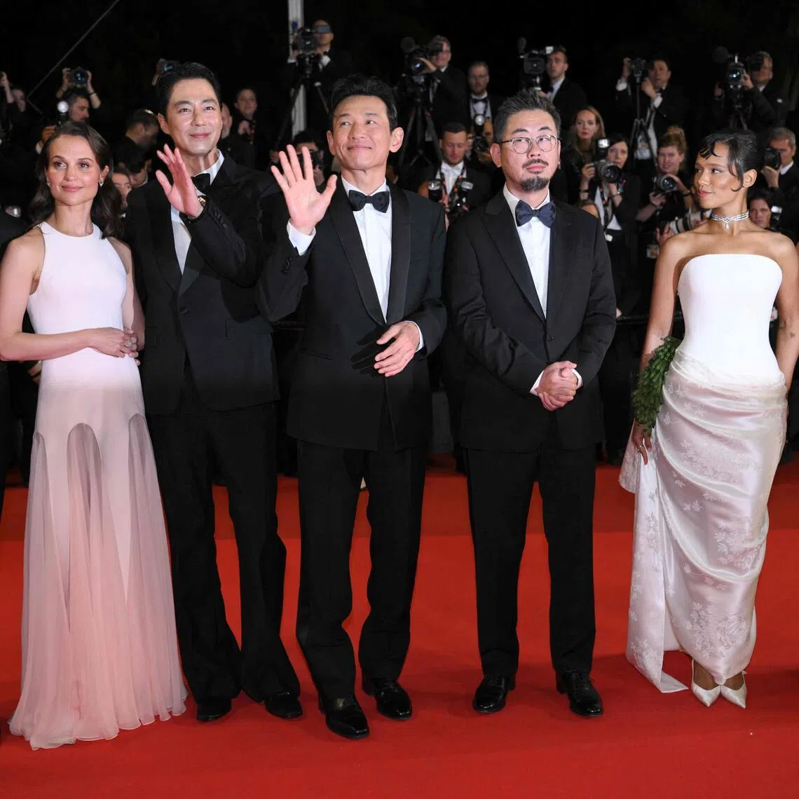 (From left) German actor Michael Fassbender, Swedish actress Alicia Vikander, South Korean actor Zo In-Sung, South Korean actor Hwang Jung-Min, South Korean director and screenwriter Na Hong-jin, Canadian actress Taylor Russell and South Korean actress Jung Ho-yeon arrive for the screening of the film Hope at the 79th edition of the Cannes Film Festival on May 17.