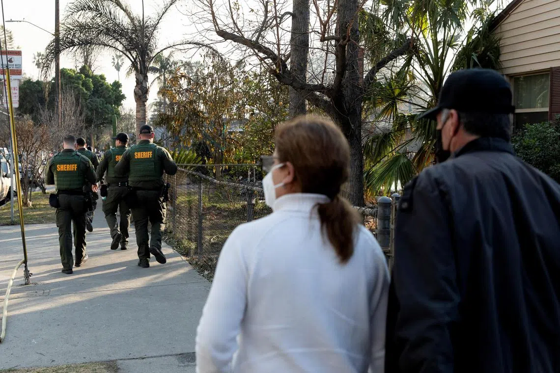 Los Angeles County Sheriff's Department officers patrol the streets to prevent looting in a neighbourhood impacted by the Eaton Fire in Altadena, California.