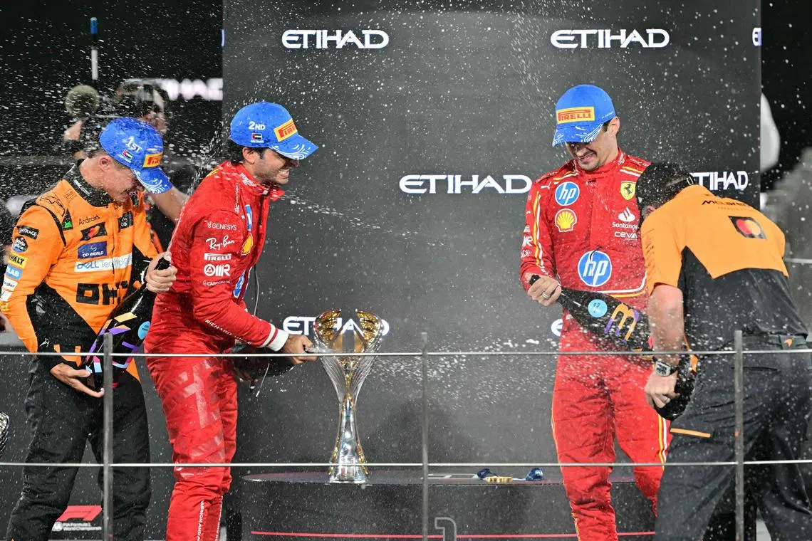 From left: McLaren's Lando Norris, Ferrari's Carlos Sainz and Charles Leclerc on the podium at the Abu Dhabi Grand Prix.