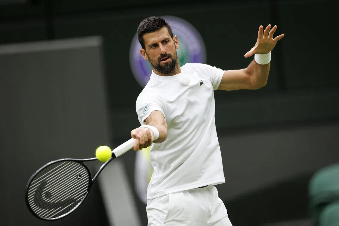 Serbia's Novak Djokovic practising on Wimbledon's Centre Court with Spain's Carlos Alcaraz on June 26.