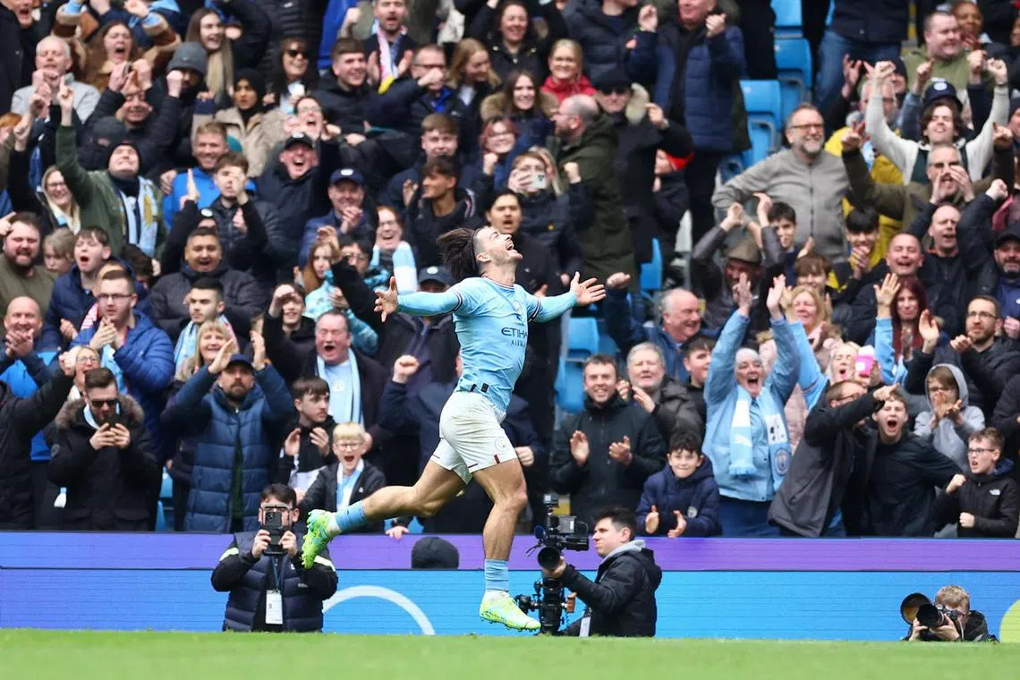 Manchester City's Jack Grealish celebrates scoring their fourth goal in the 4-1 win over Liverpool.