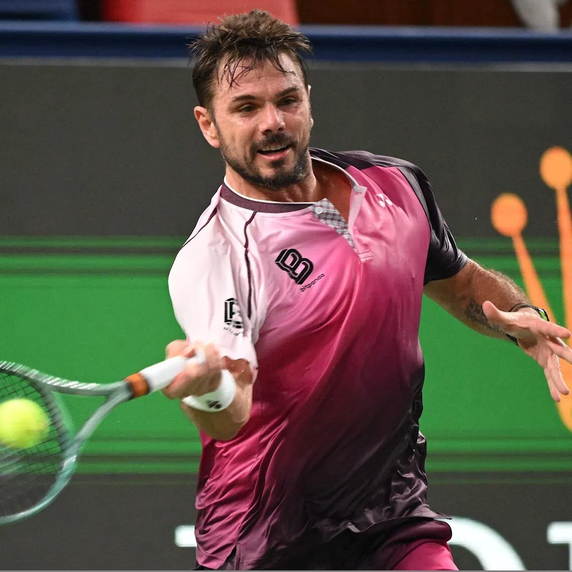 Switzerland’s Stan Wawrinka hits a return to Hungary’s Fabian Marozsan in their men's singles match at the Shanghai Masters tennis tournament in Shanghai on October 1, 2025. (Photo by Jade Gao / AFP)