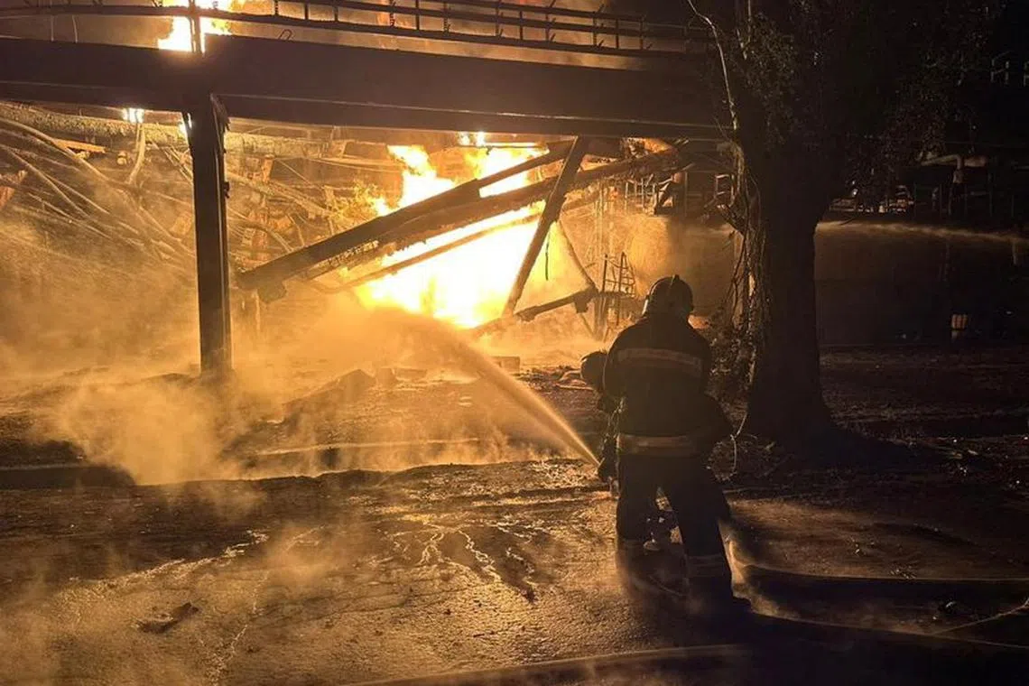 Firefighters work at an oil refinery which was hit during Russia's drone attacks in Kremenchuk, Poltava region, Ukraine November 1, 2023. Head of the Poltava Regional Military Administration Filip Pronin/Handout via REUTERS