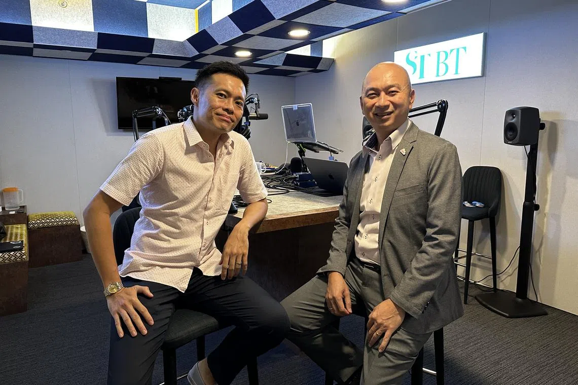 ST's senior transport correspondent Lee Nian Tjoe (left) and Mr Nicholas Wong - general manager of Kah Motor - debate recent ideas raised on bringing down high COE premiums.