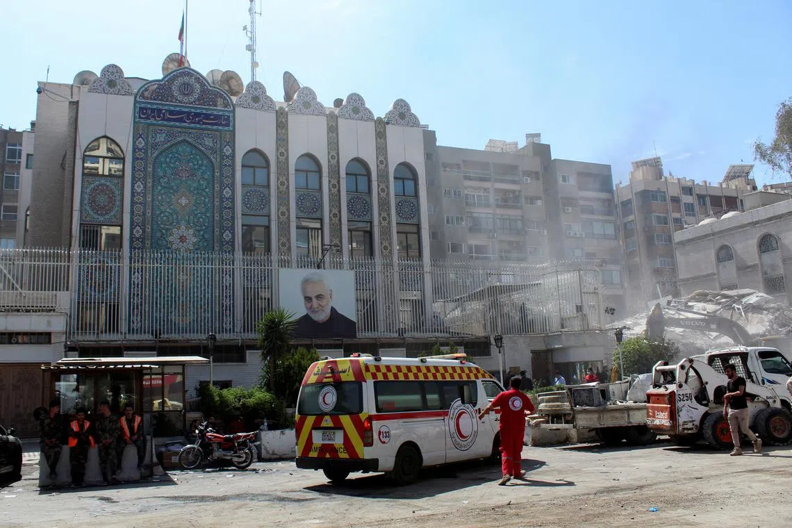 An ambulance is parked outside the Iranian embassy after a suspected Israeli strike on Monday on Iran's consulate.
