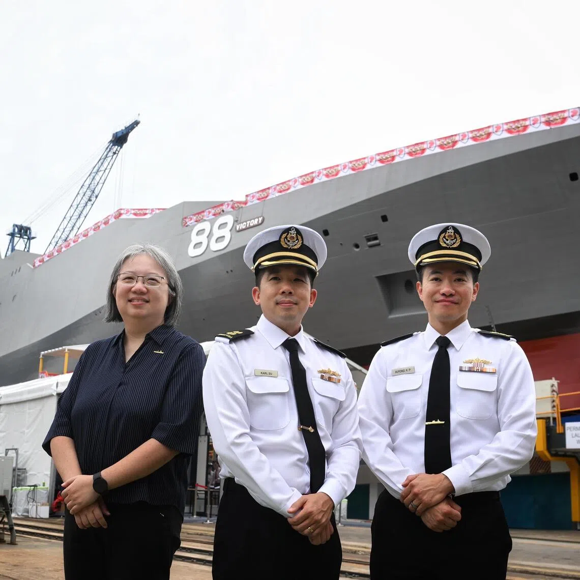(From left) Defence Science and Technology Agency’s senior programme manager (combat systems tech development) Tan Hui Ling, Lieutenant-Colonel Karl Su and Lieutenant-Colonel Auyong Kok Phai with MRCV Victory on Oct 21.