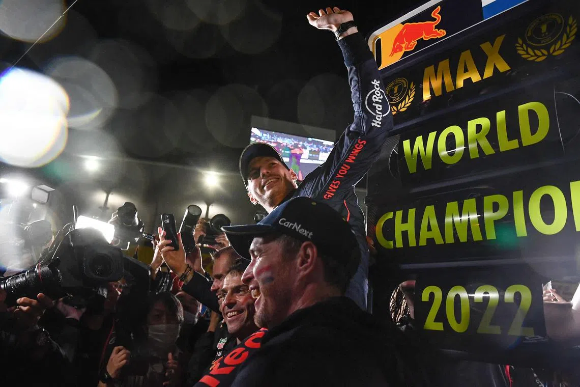 Red Bull driver Max Verstappen celebrating after winning the 2022 world championship at the Formula One Japanese Grand Prix at Suzuka.
