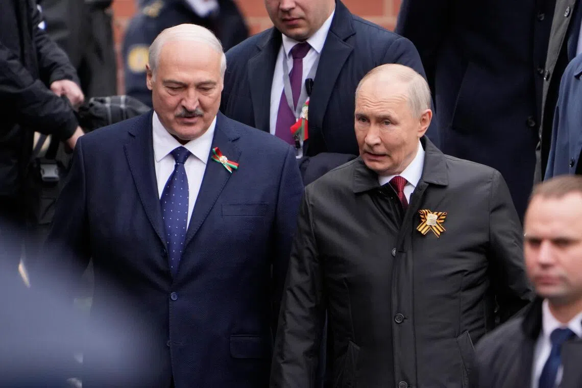Belarusian President Alexander Lukashenko (left) attending Russia's Victory Day military parade on May 9, with Russian President Vladimir Putin.