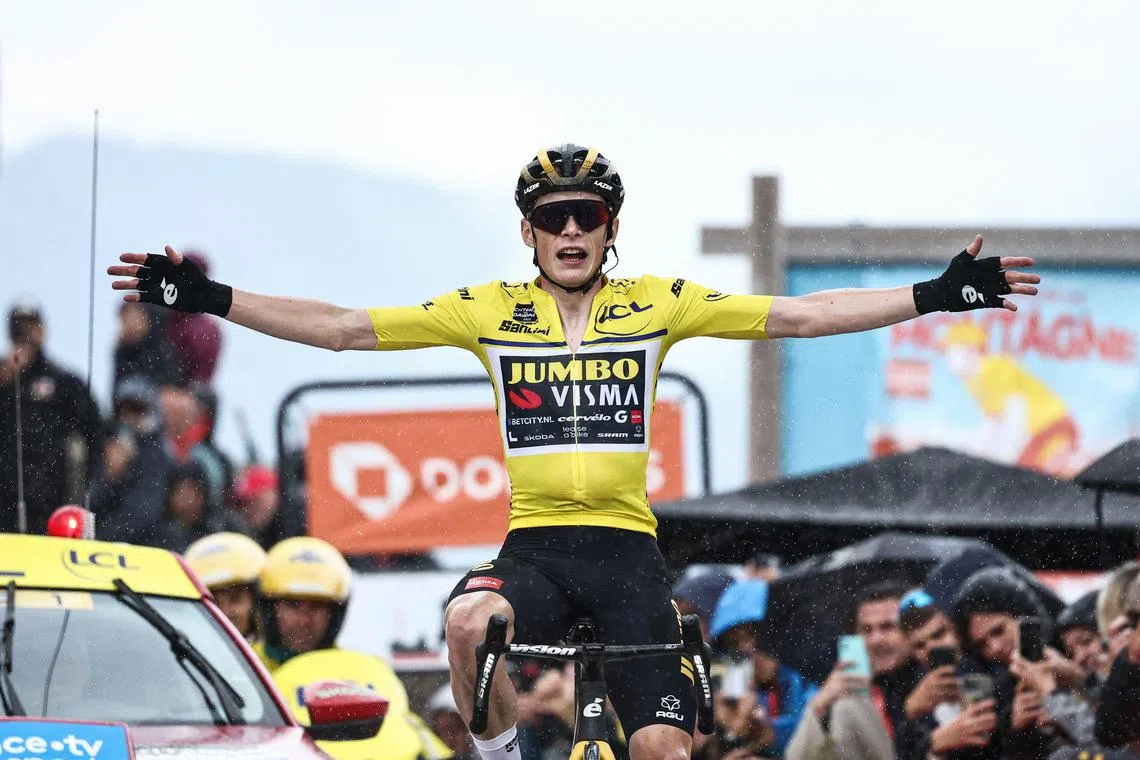 Jumbo-Visma's Danish rider Jonas Vingegaard celebrating as he crosses the finish line during the seventh stage of the 75th edition of the Criterium du Dauphine cycling race. He will likely square off with Team UAE's Tadej Pogacar for the Yellow Jersey at July's Tour de France.