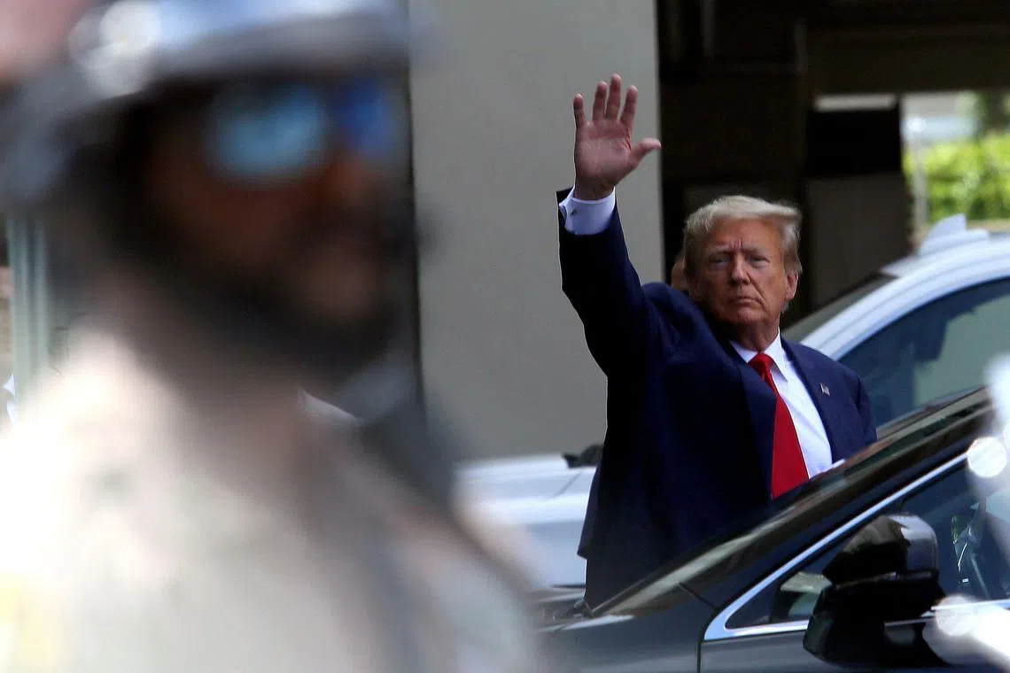 Former US president Donald Trump waving at supporters after he was arraigned in Miami, Florida.