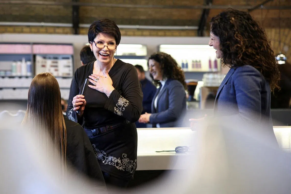 Berlin’s Senator for Labour and Integration Cansel Kiziltepe meets Valentyna Vysotska, a Ukrainian refugee who is employed at a hairdressing salon in Charlottenburg, Berlin, Germany, April 22, 2024. REUTERS/Liesa Johannssen