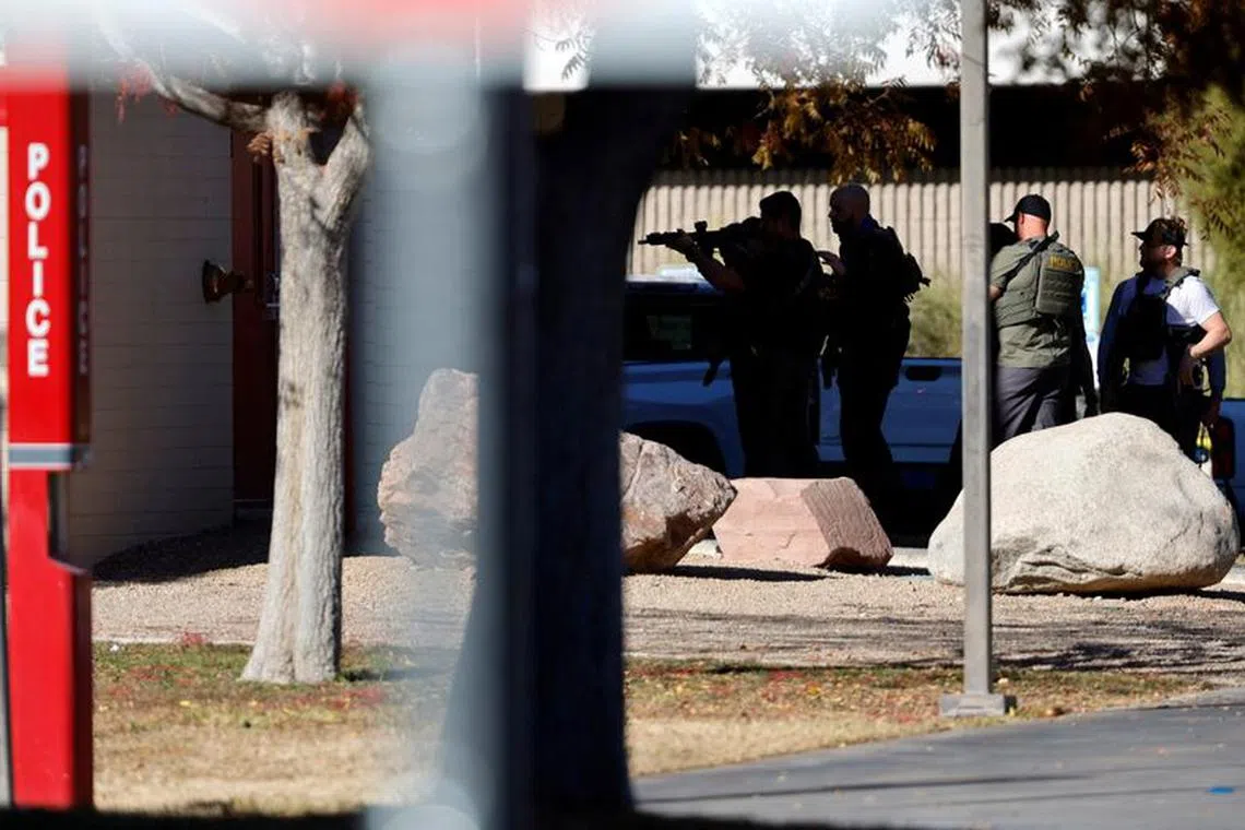 Law enforcement officers head into UNLV campus after reports of an active shooter in Las Vegas, Nevada, U.S. December 6, 2023. Steve Marcus/Las Vegas Sun via REUTERS