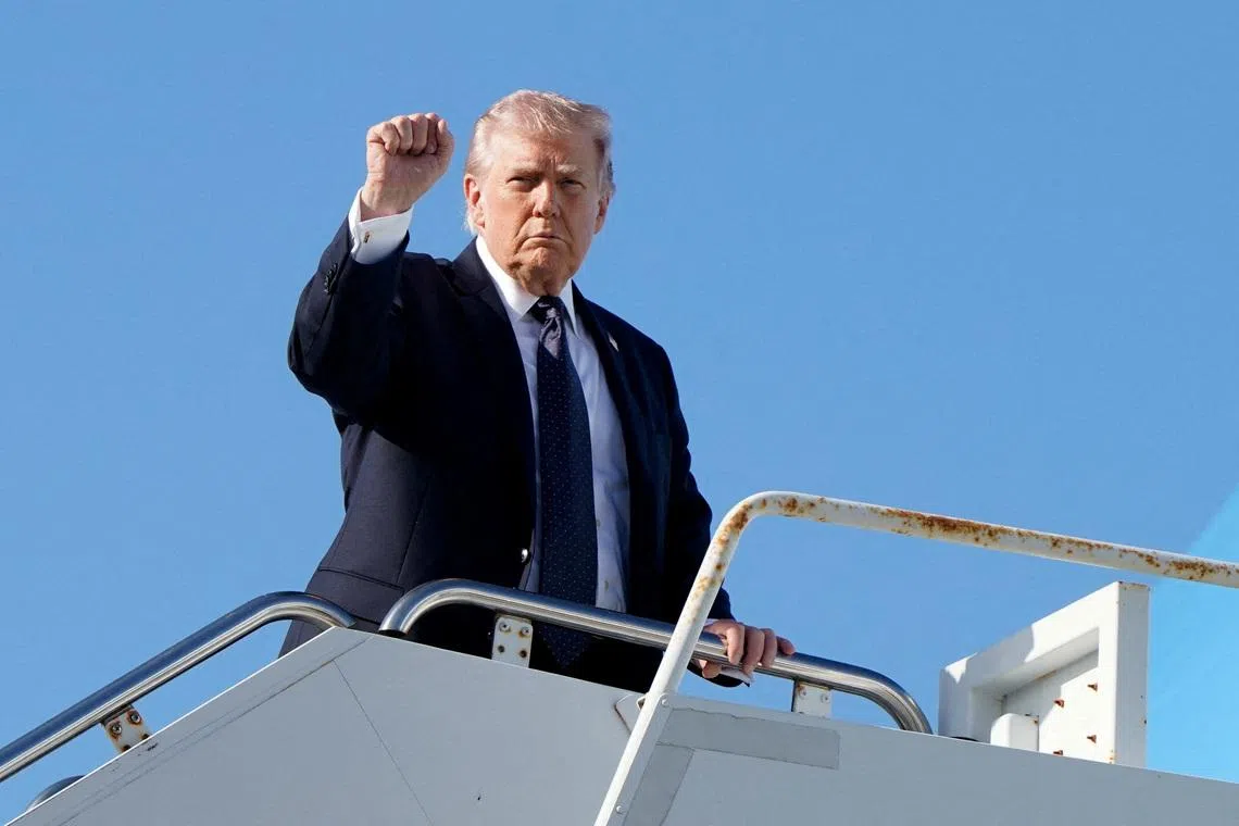 FILE PHOTO: U.S. President Donald Trump gestures as he boards Air Force One at Palm Beach International Airport in West Palm Beach, Florida, U.S., March 1, 2026. REUTERS/Elizabeth Frantz/File Photo