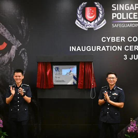 SAC Justin Wong, Commander Cyber Command and CP How Kwang Hwee, Commissioner of Police, unveiling a plaque at Cyber Command Inauguration Ceremony, at the Police Cantonment Complex on July 3.