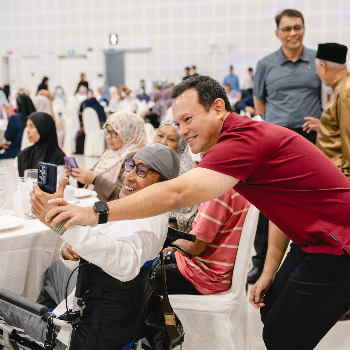 Acting Minister-in-Charge of Muslim Affairs, Zaqy Mohamad engaging with seniors at the MUIS Zakat Beneficiaries Seniors Day 2026 on Sept 3.