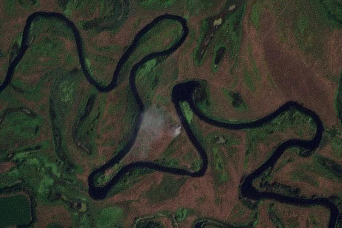 A satellite image shows smoke near the area where a pontoon bridge over the Seym River was destroyed, near Glushkovo, Kursk Region, Russia, on Aug 19, 2024.