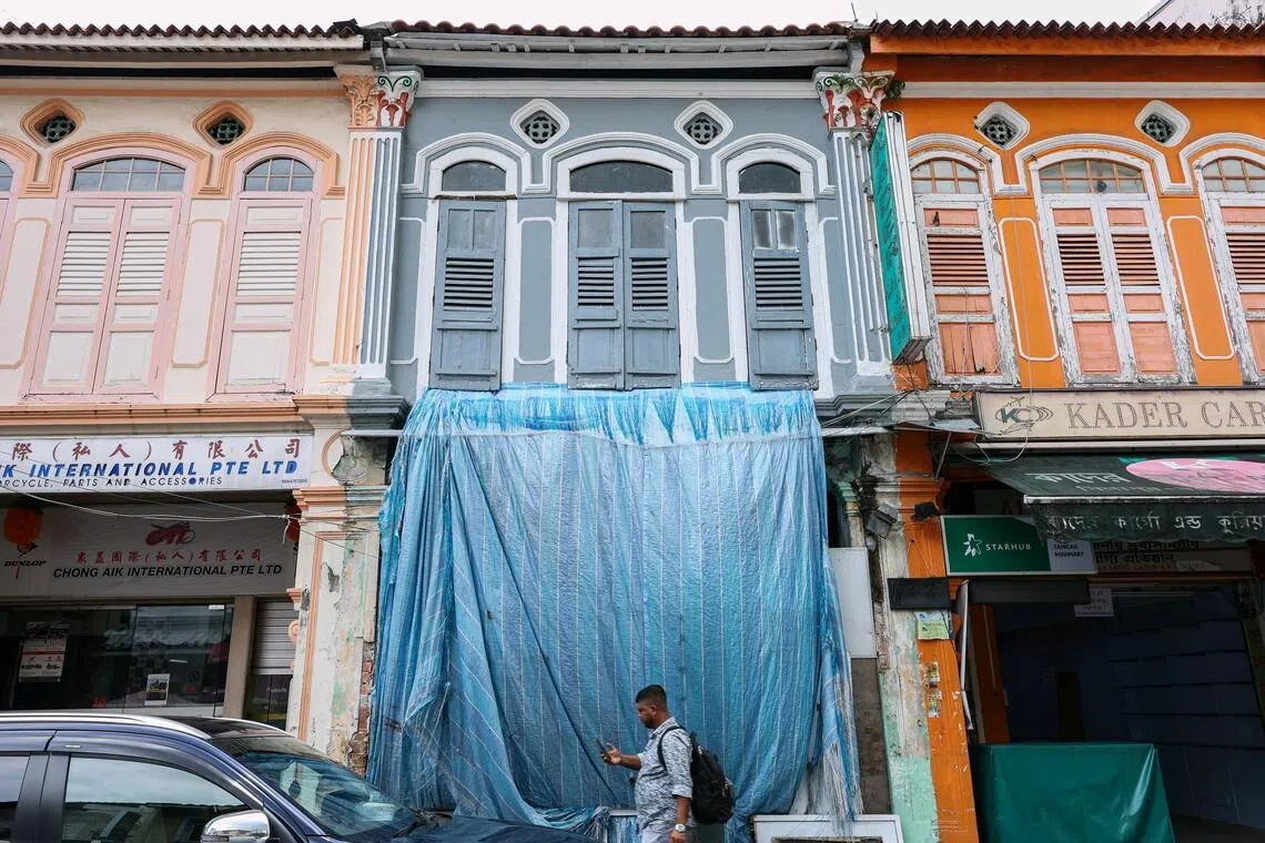 Man, construction company fined for unauthorised works to conserved shophouse in Little India