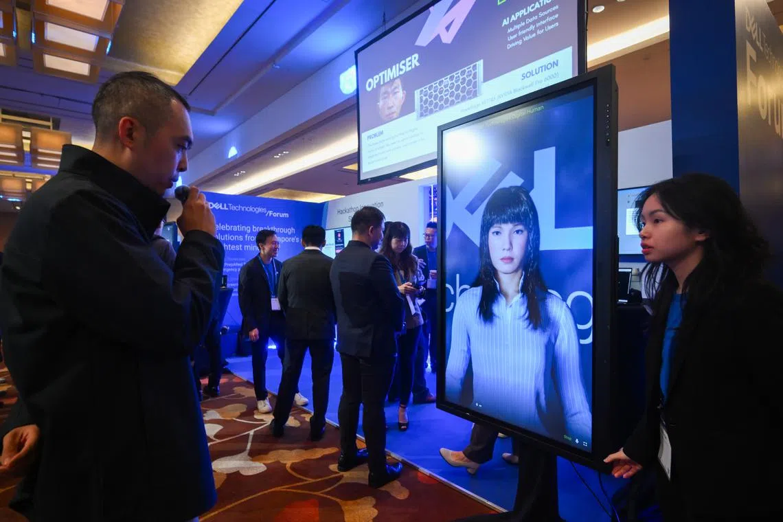 A staff member interacts with Emma, a digital avatar, at the Dell Technologies Forum 2025 on Aug 21.