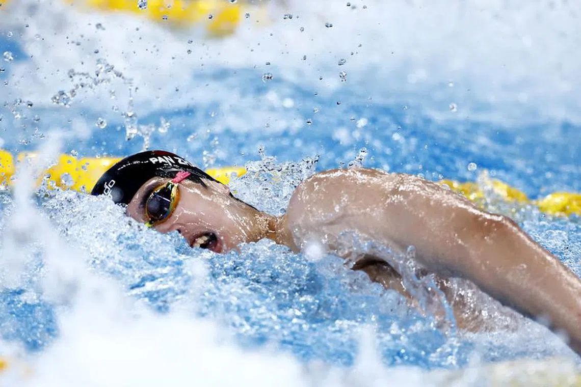 Swimming - World Aquatics Championships - Aspire Dome, Doha, Qatar - February 11, 2024 China's Pan Zhanle in action during the men's 4x100m freestyle relay heats REUTERS/Clodagh Kilcoyne