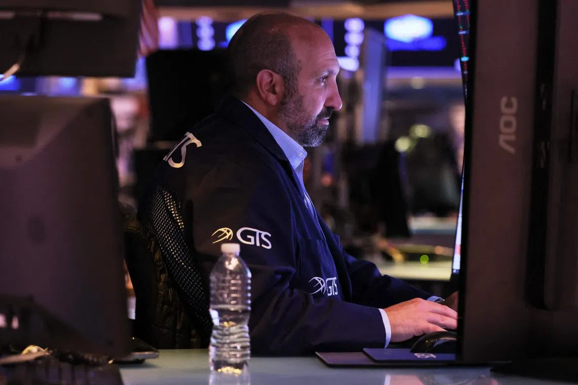 Traders work on the floor of the New York Stock Exchange during afternoon trading, in New York City.