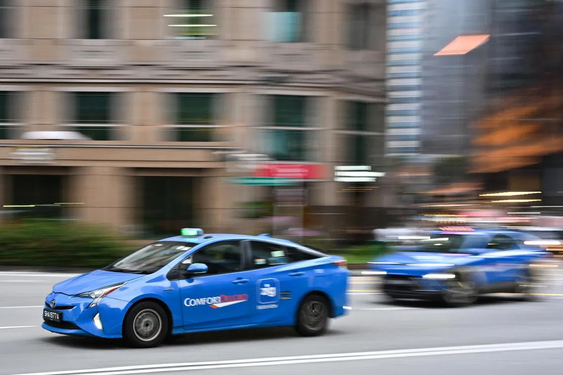 ST20250226-202556800625-Lim Yaohui-pixgeneric/
ComfortDelGro taxis driving outside One Finlayson Green along Finlayson Green near Raffles Place MRT station on Feb 26, 2025.
Can be used for stories on ride-hailing, Comfort, taxi, money, car, road, safety, traffic regulation, LTA, transport, fare, and vehicle.
(ST PHOTO: LIM YAOHUI)
