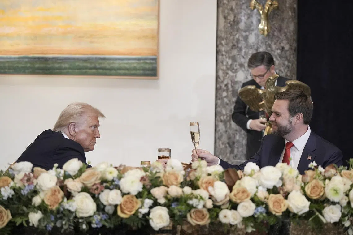 President Donald Trump toasts with Vice President JD Vance during an inaugural luncheon inside the National Statuary Hall at the Capitol on Jan 20, 2025. 