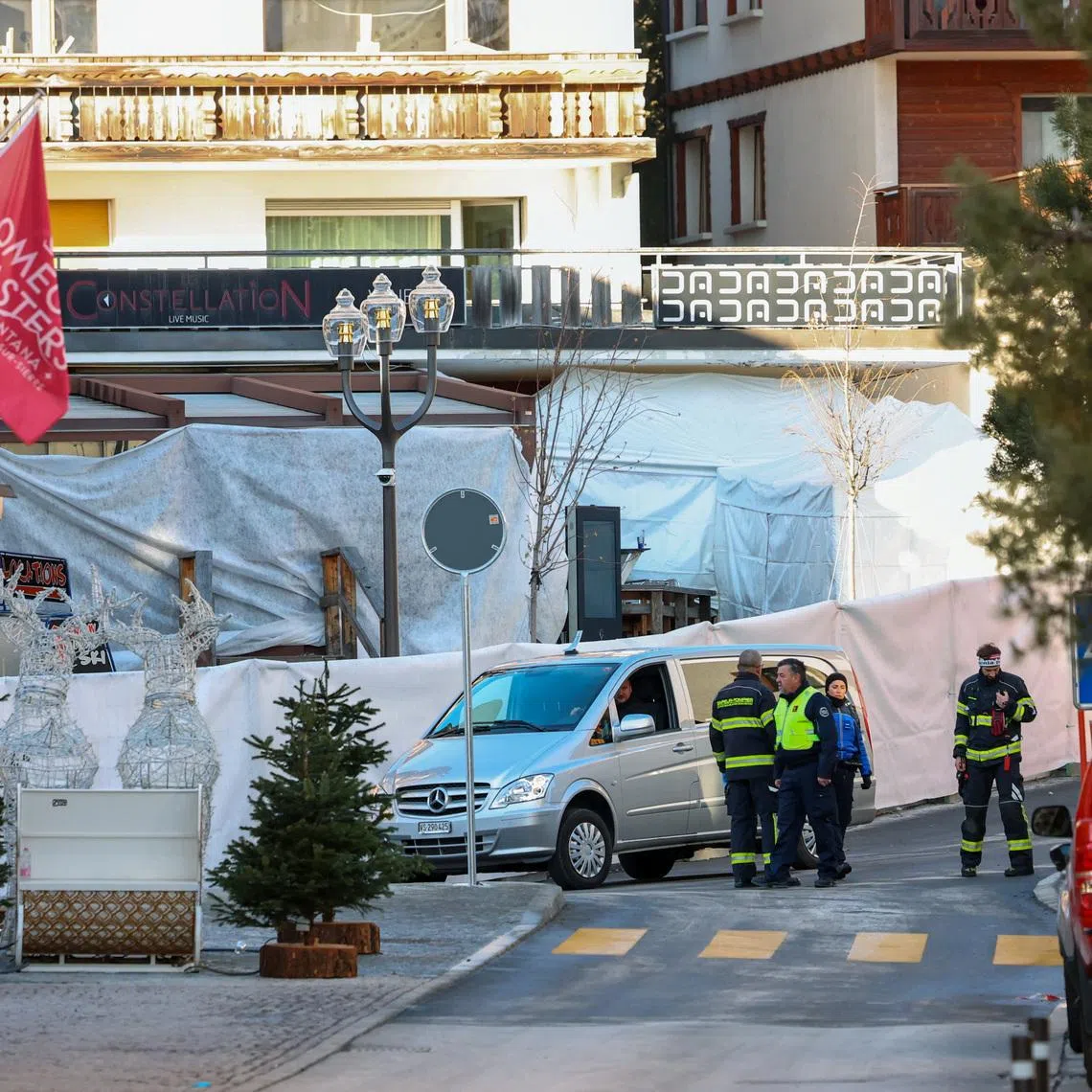 Emergency personnel work outside the \"Le Constellation\" bar, after an explosion and fire during a New Year’s Eve party where several people died and others were injured, according to Swiss police, in the upscale ski resort of Crans-Montana in southwestern Switzerland, January 1, 2026. REUTERS/Denis Balibouse