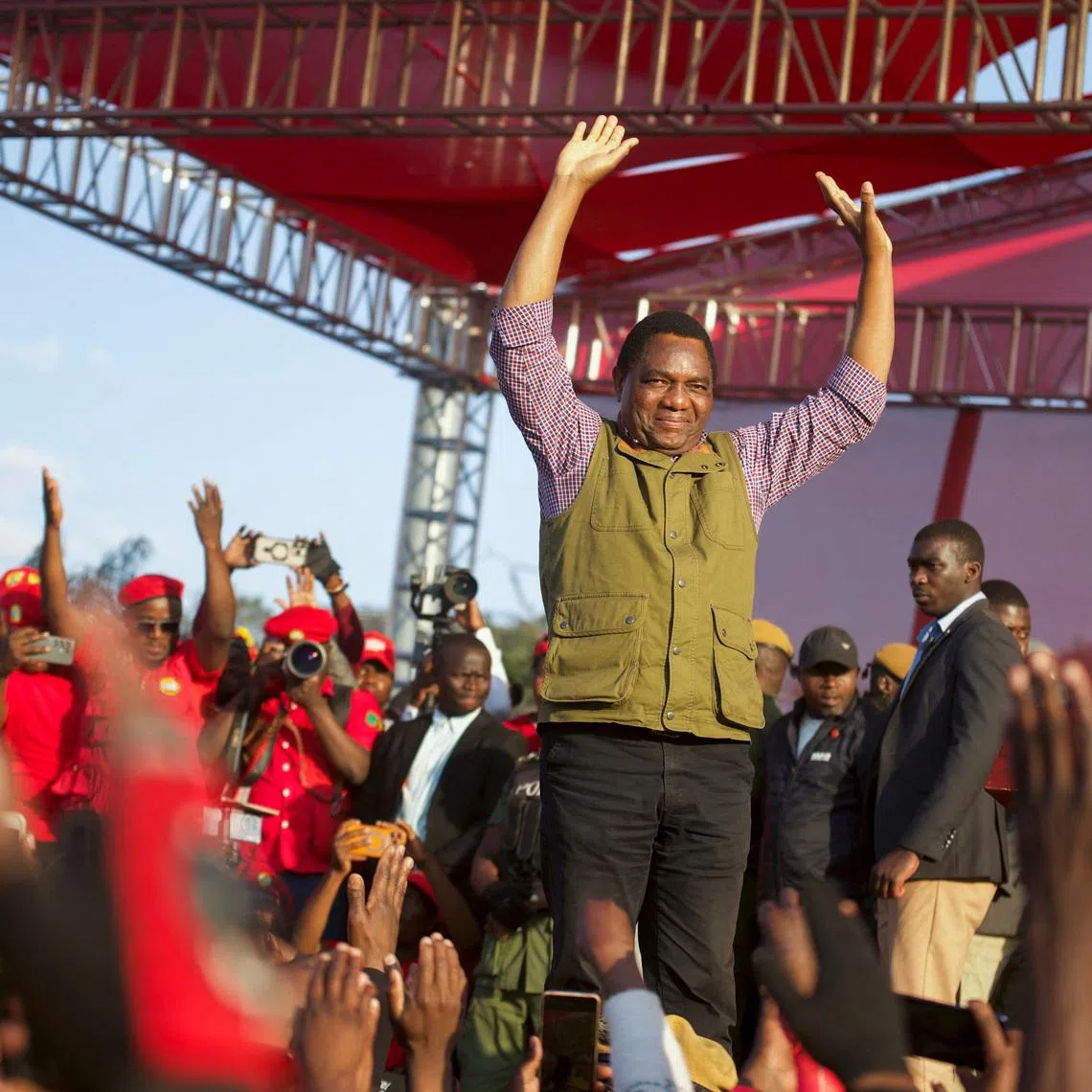 FILE PHOTO: Zambia's President Hakainde Hichilema greets United Party for National Development (UPND) supporters during their election campaign launch in Lusaka, Zambia, June 28, 2026. REUTERS/Moses Mwape/File Photo