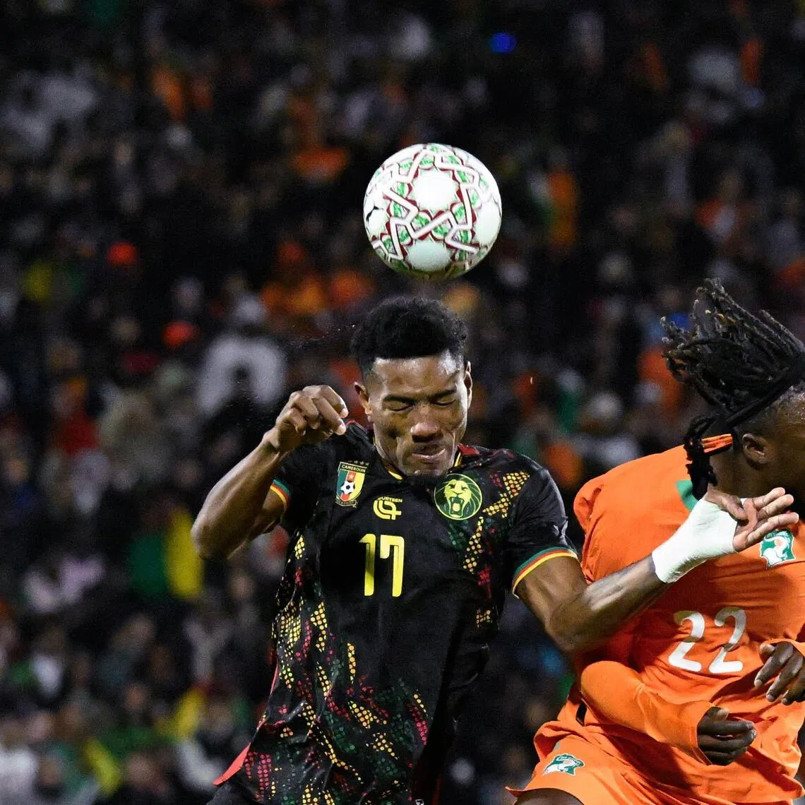Cameroon defender Samuel Kotto is challenged by Ivory Coast forward Sebastien Haller in their Africa Cup of Nations Group F football match at Marrakesh Stadium, Morocco on Dec 28, 2025.