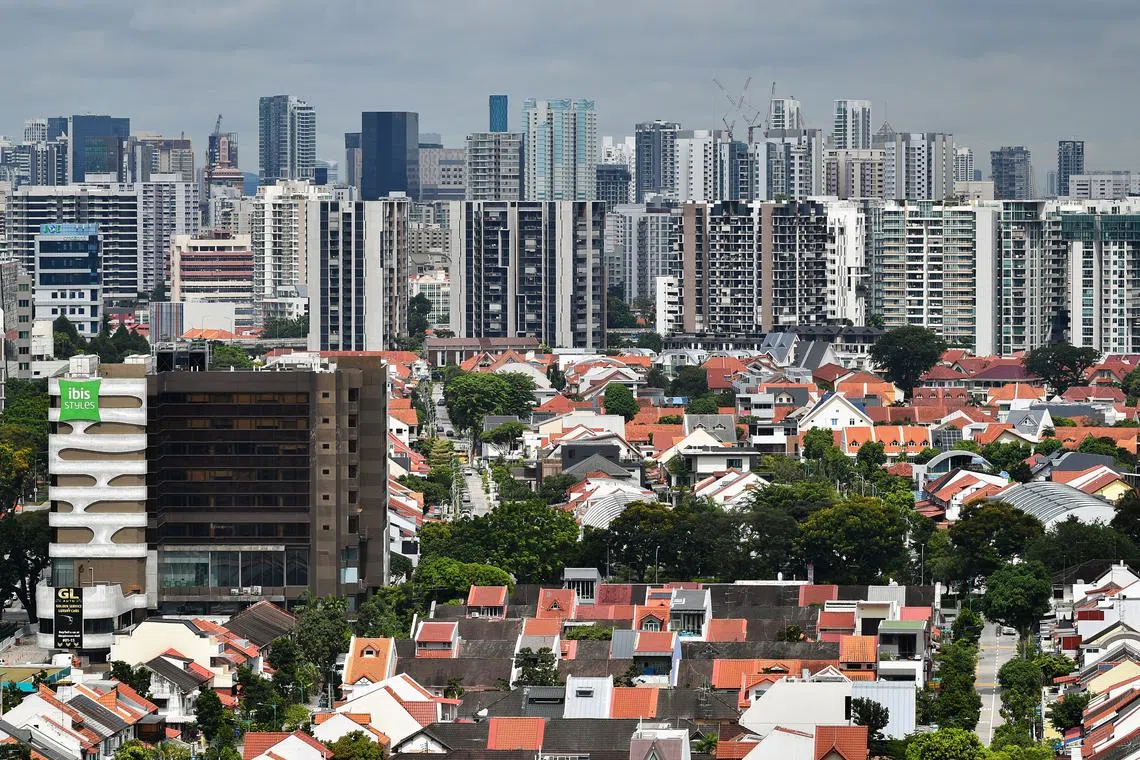 HDB flats, landed property, private housing estate, office buildings, condominiums and ibis Styles Singapore On Macpherson hotel, as viewed from the rooftop of Novelty BizCentre on Aug 19, 2021.