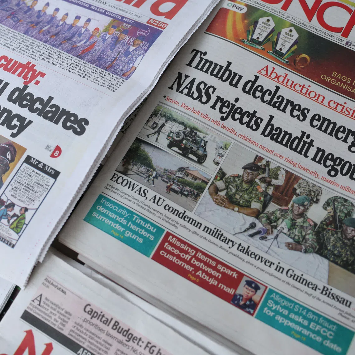 Front pages featuring headlines are displayed at a newspaper stall in Lagos, Nigeria, November 27, 2025. REUTERS/Sodiq Adelakun