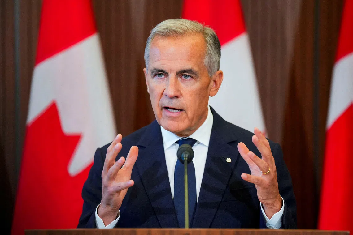 Canada’s Prime Minister Mark Carney speaks with the news media after he suspended trade negotiations with the United States on Aug 22.