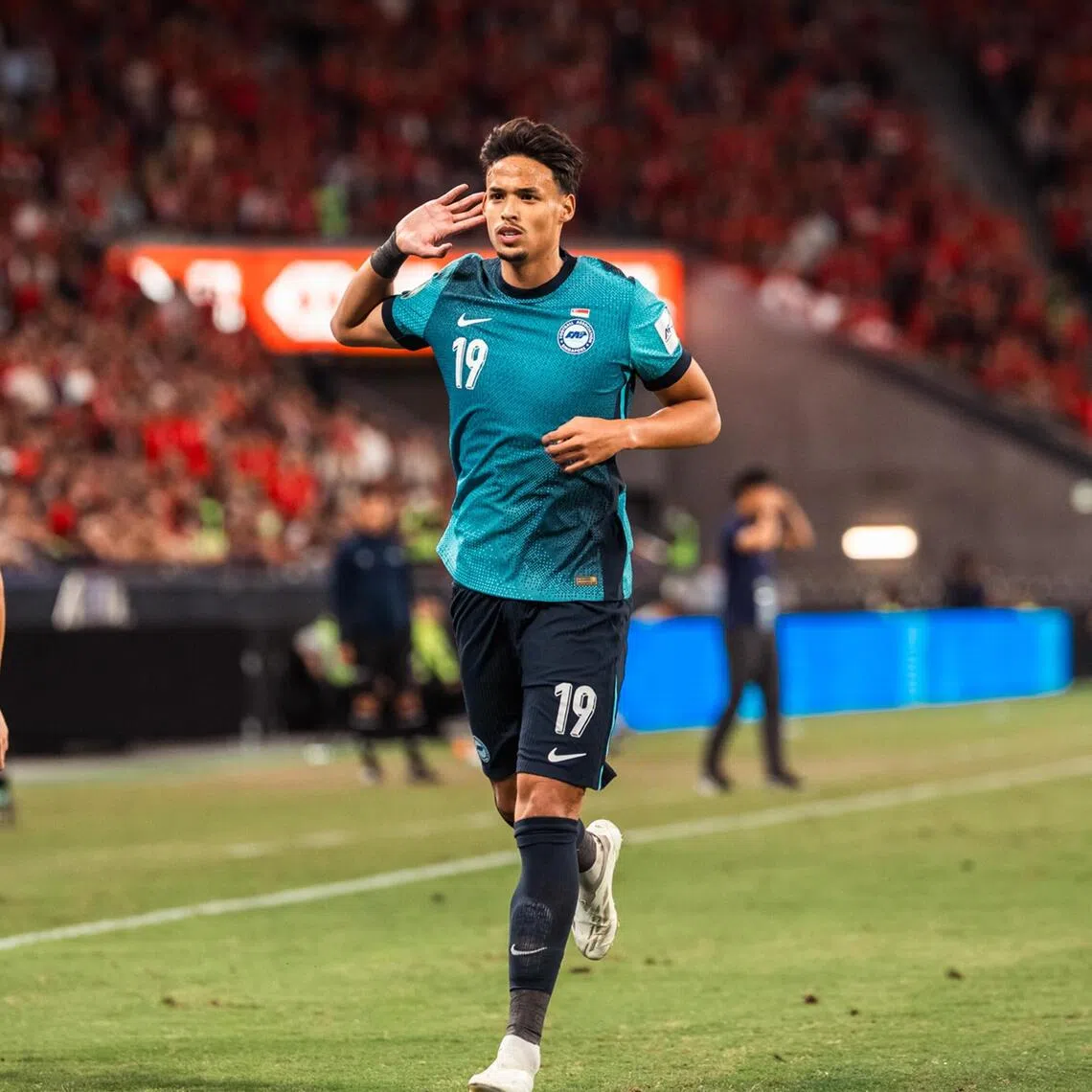Ilhan Fandi celebrating with older brother Ikhsan Fandi (left) after scoring the winner in the 2-1 victory over Hong Kong at the Kai Tak Stadium on Nov 18.
