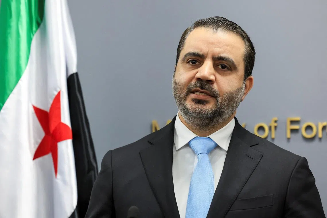 FILE PHOTO: Syrian Foreign Minister Asaad Al-Shibani attends a press conference at the Lebanese foreign ministry, in Beirut, Lebanon, October 10, 2025. REUTERS/Mohamed Azakir/File Photo