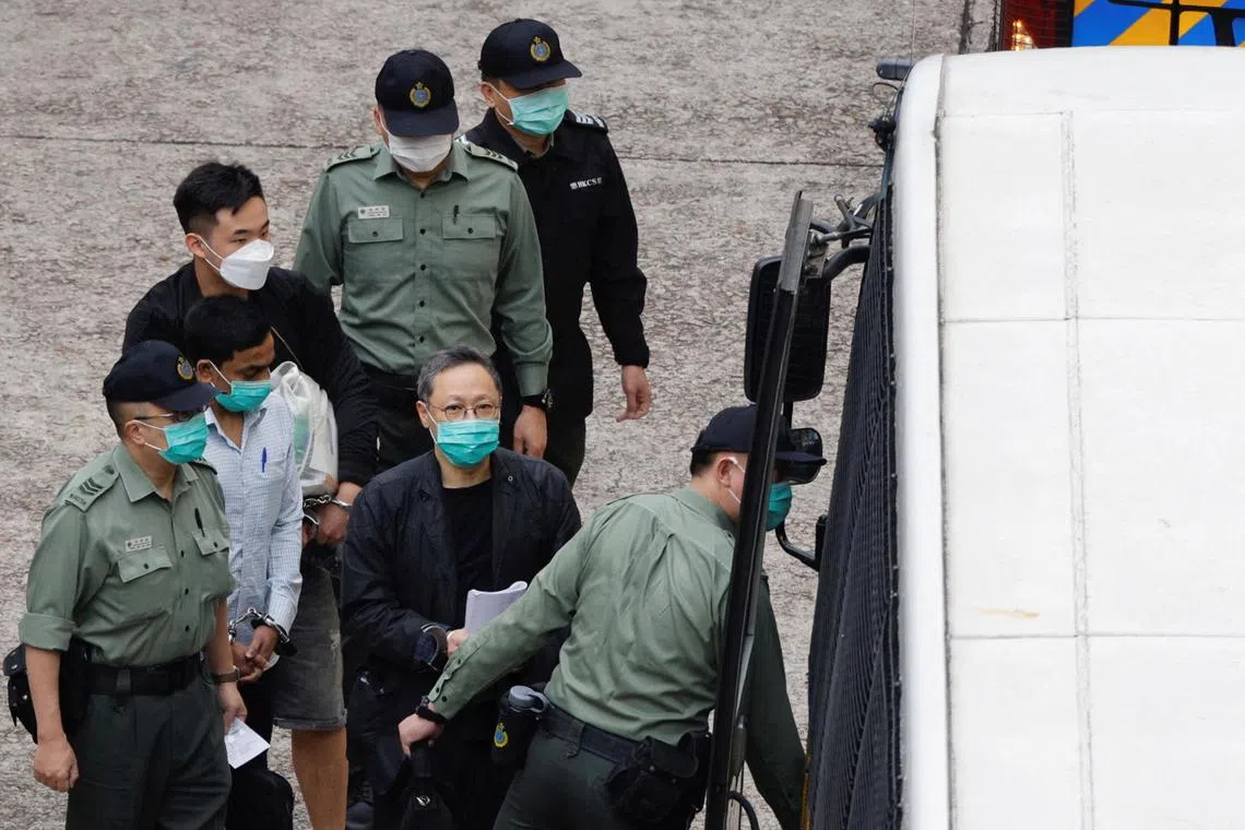 FILE PHOTO: Pro-democracy activist Benny Tai walks to a prison van to head to court over the national security law charge, in the early morning, in Hong Kong, China March 2, 2021. REUTERS/Tyrone Siu/File Photo
