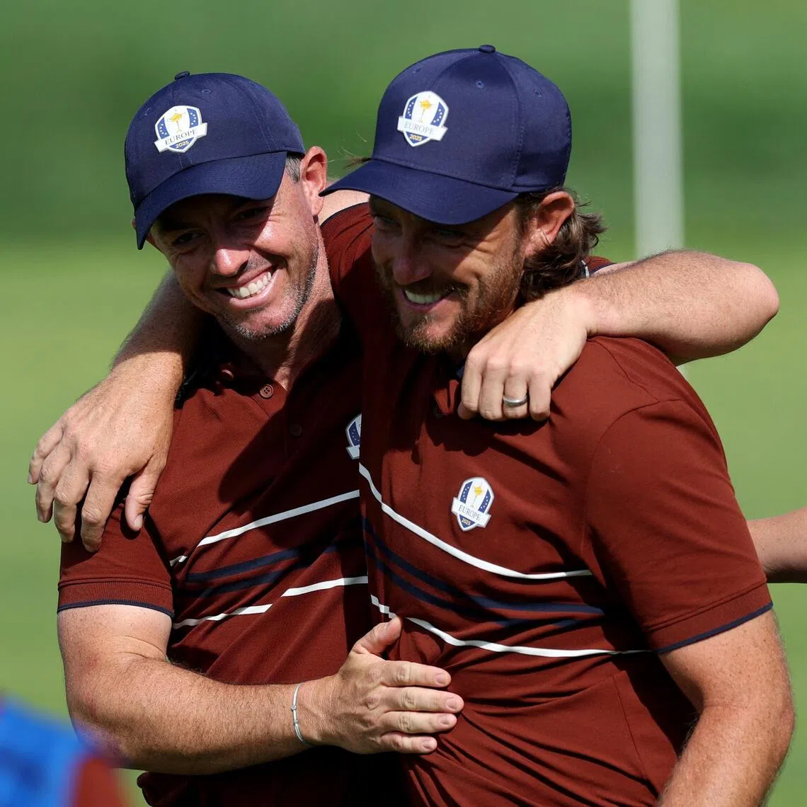 Team Europe's Rory McIlroy (left) and Tommy Fleetwood celebrate after winning the match on the 16th hole during the foursomes.