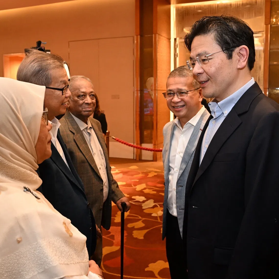 (From right) PM Lawrence Wong and Law Minister Edwin Tong speaking to attendees at a dinner on Oct 23 to mark the 60th anniversary of PA’s Citizens’ Consultative Committees.