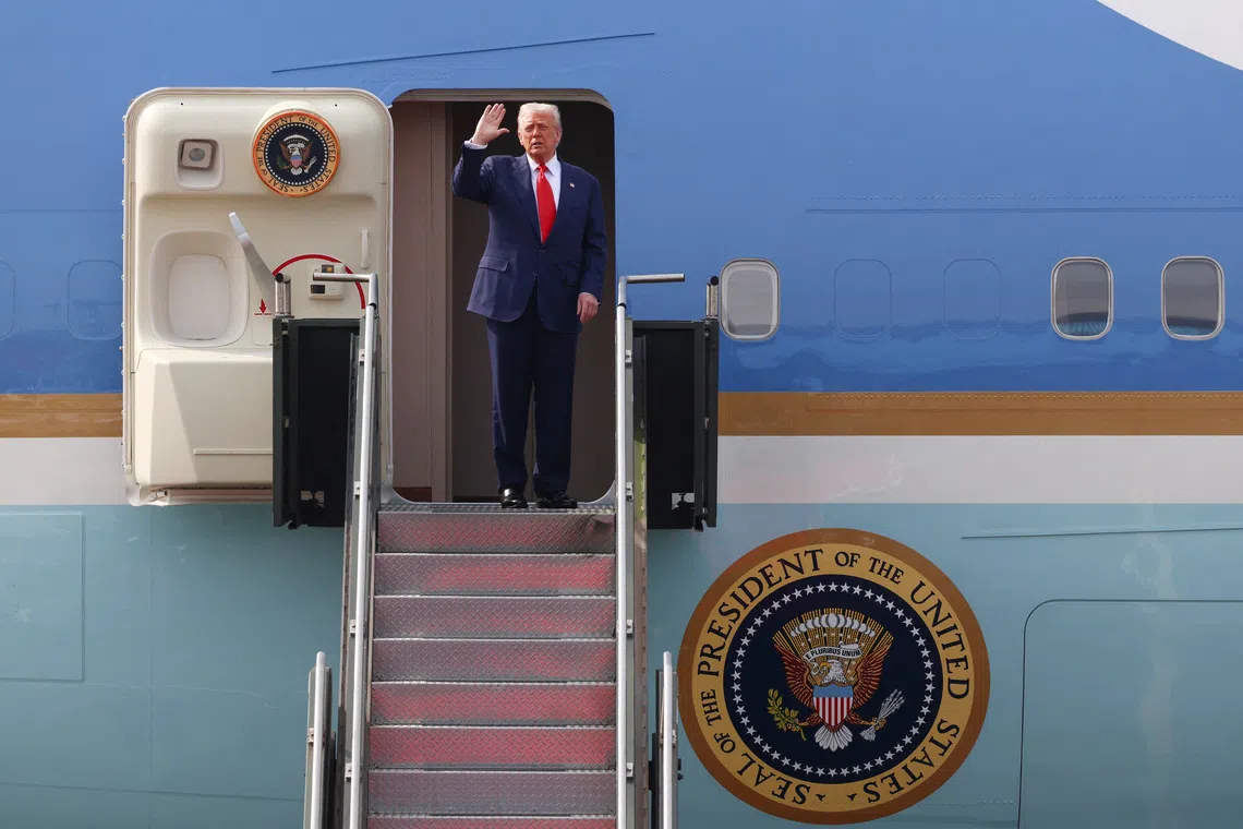 US President Donald Trump gestures as he boards the Air Force One at Gimhae International Airport in Busan, South Korea, on Oct 30.